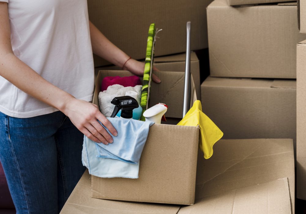 crop-woman-packing-boxes